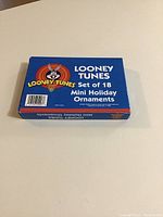 Top view of the unopened blue box containing the Looney Tunes mini holiday ornaments.