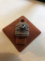 Front view of the sterling silver ring showing the large Tahitian pearl centerpiece and marcasite-studded band arranged in multiple rows.