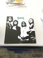 Front of the Nazareth LP cover showing band members in black and white.