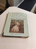Front cover of the book with dust jacket showing title and photo of Princess Elizabeth seated in a room.