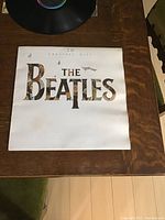 Front cover of 'The Beatles 20 Greatest Hits' album showing some age and wear.