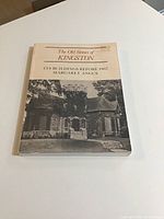 Front cover of the soft cover book titled 'The Old Stones of Kingston' showing an old stone building photograph and author name.