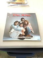 Front cover of 'The Who - Who's Better, Who's Best' vinyl album featuring image of band members.