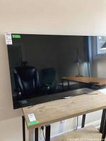 Front view of LG 55" flatscreen TV on table