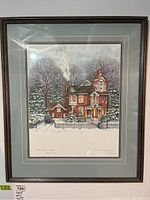 Full view of the framed print in wooden frame and triple mat with a winter Victorian house scene.