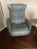 Front view of light gray-blue leather chair