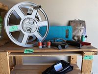 Wide view of entire lot with hose reel, kneeling pad, tools and decor