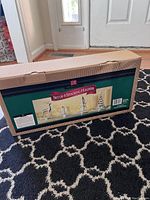 Box showing retail packaging of set of 4 stocking holders with image of items on front.