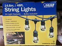 Photo of the box front showing product name, length of string lights, bulb count, UL approval, weatherproof feature, heavy-duty cord, bulb spacing and connection capability.