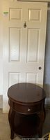 White interior door with 6 panels and round doorknob hole, standing upright.