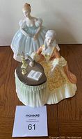 Both Royal Doulton figurines together showing scale and details.