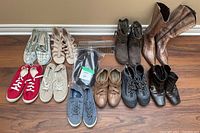 Photo of all shoes in the lot, showing variety of styles and colors including boots, athletic shoes, slip-ons, and casual shoes in size 8.5.