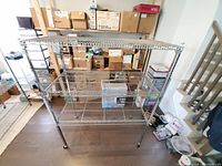 Front view of metal shelving unit with boxes stored on the shelves.