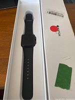 Apple Watch Series 3 black color with black sport band inside original white box.