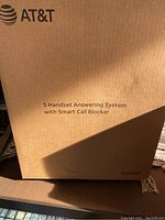 Box of AT&T 5 handset answering system with smart call blocker, showing brand and product information.