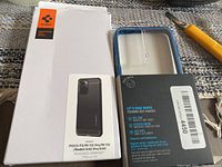 Photo showing white packaging with Spigen logo and image of black Rugged Armor case for POCO F3/Mi11X Pro/Mi11X/Redmi K40 Pro/K40