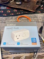 Front view of BroadLink Smart Plug Mini packaging showing product image, branding, and key features such as Frustration-Free Setup and Certified for Humans.