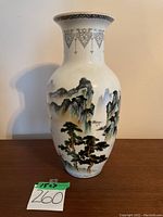 Front view of full vase showing painted landscape and overall shape