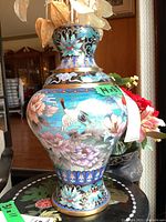 Front view showing full body and neck decoration