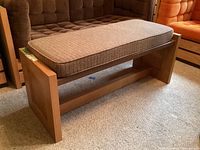 Oak bench with cushion installed, front angle