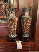 Frontal view of both cloisonné vases on stands