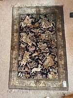 Full top view of entire carpet laid flat showing field, border, fringe and overall condition