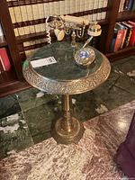 Front view of entire brass marble table with integrated telephone