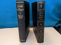 Side view of two hardcover vintage books showing spine titles: 'Joseph in Egypt' by Thomas Mann and 'Pierre and Jean' by Guy de Maupassant.