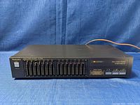 Front view of the Technics SH-Z200 graphic equalizer showing the full panel with 10 frequency band sliders and power button.