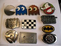 Top view of all 11 belt buckles showing front details.