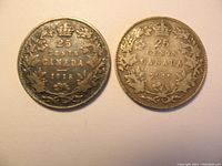 Obverse and reverse views of both Canadian 25 cent coins dated 1918 and 1919, showing worn condition.