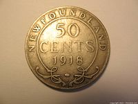 Reverse side of the 1918 Newfoundland 50 cents silver coin showing denomination and year.