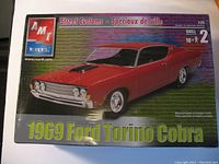 Front of the AMT Street Customs 1969 Ford Torino Cobra model kit box showing the car image, brand logo, and scale details.
