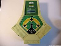 Front view of the handheld electronic baseball game showing the Coleco branding, baseball diamond gameplay area, and scoreboard.