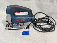 Side view of Bosch 1590EVS Orbital Professional Jig Saw showing overall condition, handle, power cord and blade area