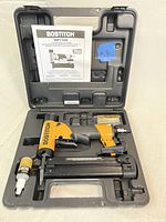 Bostitch HP118K pin nailer in its molded carrying case with manual and accessories.