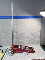 Full side view of the Craftsman aluminum floor jack with handle assembled