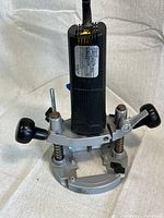 Top view showing side label and plunge base with black handles