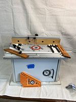 Front overview showing table top, fence, feather boards and push block