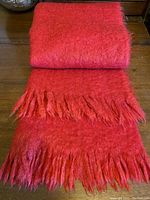 Folded blanket showing overall appearance and fringe