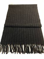 Full view of black scarf with white pinstripes, folded flat showing fringed ends.
