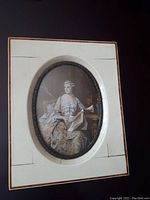 Photo of antique miniature gouache painting of Madame Pompadour showing the full frame, oval painting, and mat with some visible age cracks and wear on the mounting.