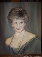 Full view of the oil painting showing Princess Diana with detailed facial features, pearl jewelry, and the artist signature.