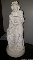 Front view showing mother sitting holding daughter with detailed facial features and flowing dresses.