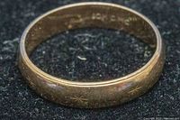 Front exterior view showing starburst engraving on band