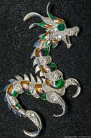 Front view photo of the large Asian dragon costume brooch showing detailed multi-color enamel and clear crystals on a silver-tone metal base.