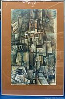 Full view of framed cubist art print with silver metal frame and orange-brown matting.