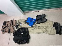 Full lot laid out showing fishing vest, waders, splash skirts, gloves and boots