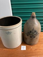 Shot showing both large white earthenware planter and stoneware jug together with size comparison