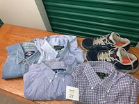 Lot spread showing three Ralph Lauren long sleeve shirts in various shades and styles and one pair of blue and white Champion sneakers.